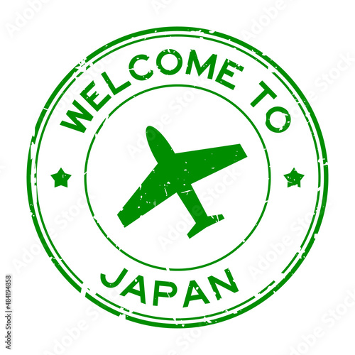 Canvas Print Grunge green welcome to Japan word with airplane icon round rubber seal stamp on