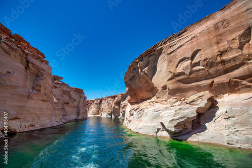 Cruise along Lake Powell. View of narrow, cliff-lined canyon from a boat in Glen Canyon National Recreation Area, Arizona..