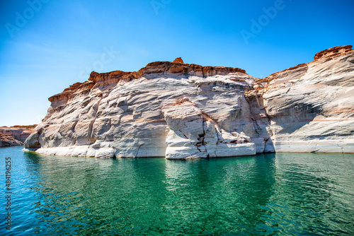 Cruise along Lake Powell. View of narrow, cliff-lined canyon from a boat in Glen Canyon National Recreation Area, Arizona..