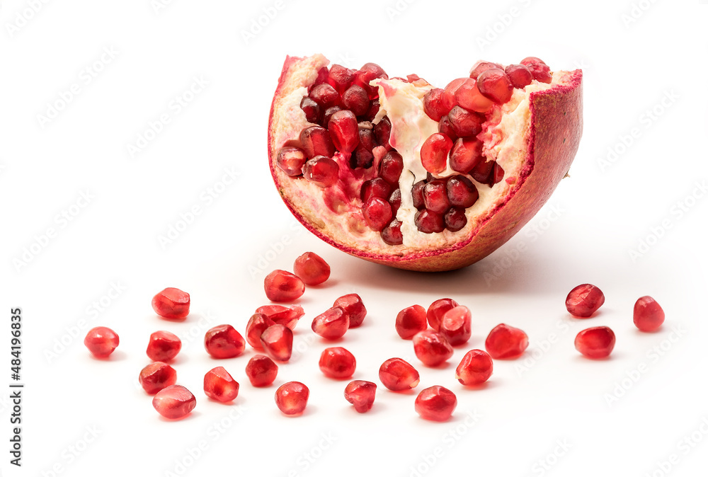 Pomegranate isolated part on a white background close-up. Fresh Garnet or pomegranate. Juicy Delicious pomegranate. Pomegranate isolated part on a white background close-up. Fresh Garnet or pomegranate. Juicy Delicious pomegranate.