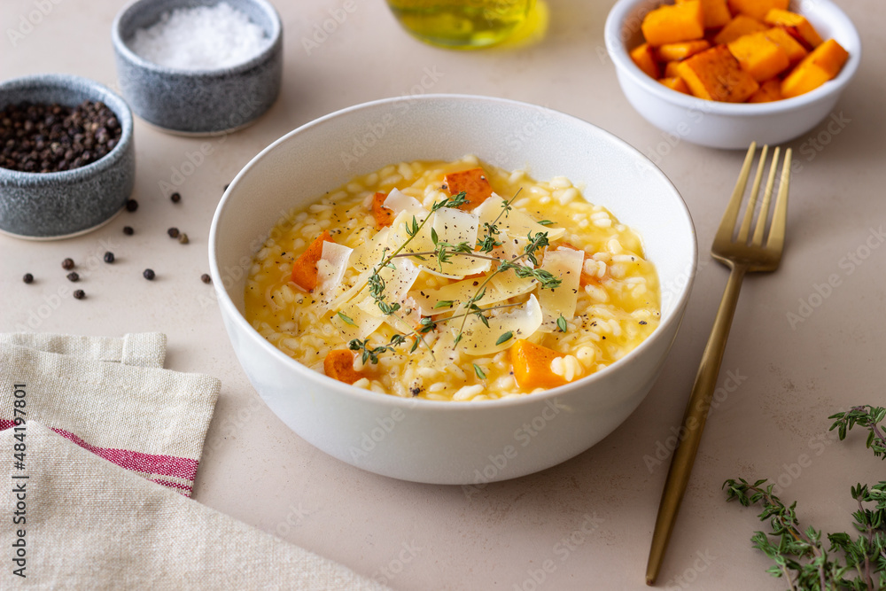 Risotto with pumpkin, cheese and thyme. Vegetarian food. Healthy eating. Risotto with pumpkin, cheese and thyme. Vegetarian food. Healthy eating.