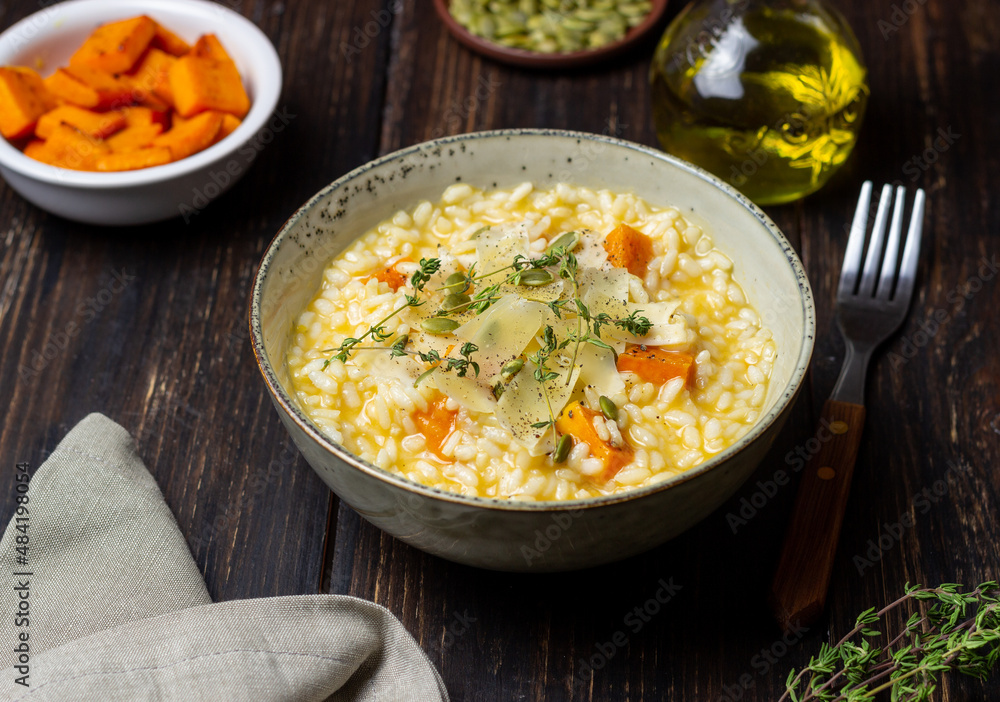 Risotto with pumpkin, cheese and thyme. Vegetarian food. Healthy eating. Risotto with pumpkin, cheese and thyme. Vegetarian food. Healthy eating.
