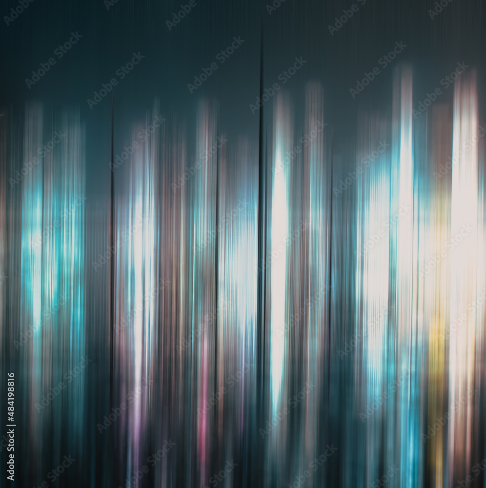 abstract background of blurred skyscrapers at night business and technology concept