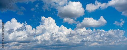Panorama photo of natural background with white clouds on blue sky