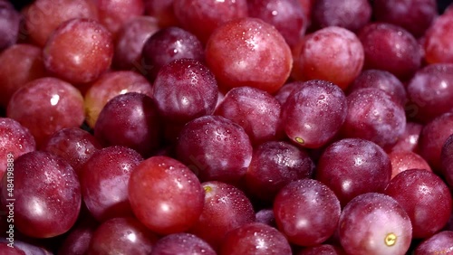 Fresh red grapes rotation background. Close up. Loop motion