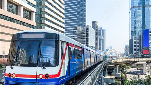 skytrain mass transit with cityscape. © TongTa
