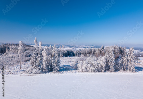 Aerial view of winter landscape covered by snow in sunny day. Czech Republic, Vysocina region highland © ArtushFoto