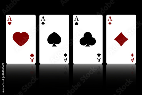 Set of four suits of playing cards with aces isolated on a black background with reflection