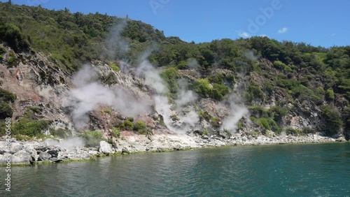 Volcanic and geothermal activity on the edge of a lake in Waimangu Rotorua New Zealand photo