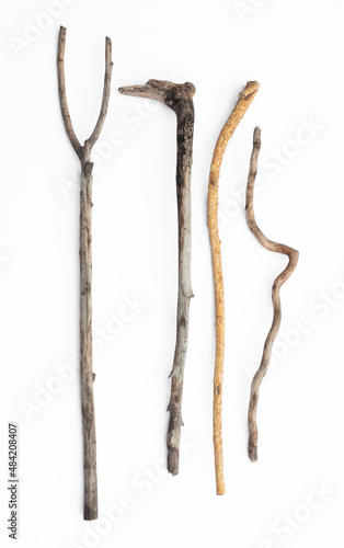 ancient sticks for walking isolated on white background