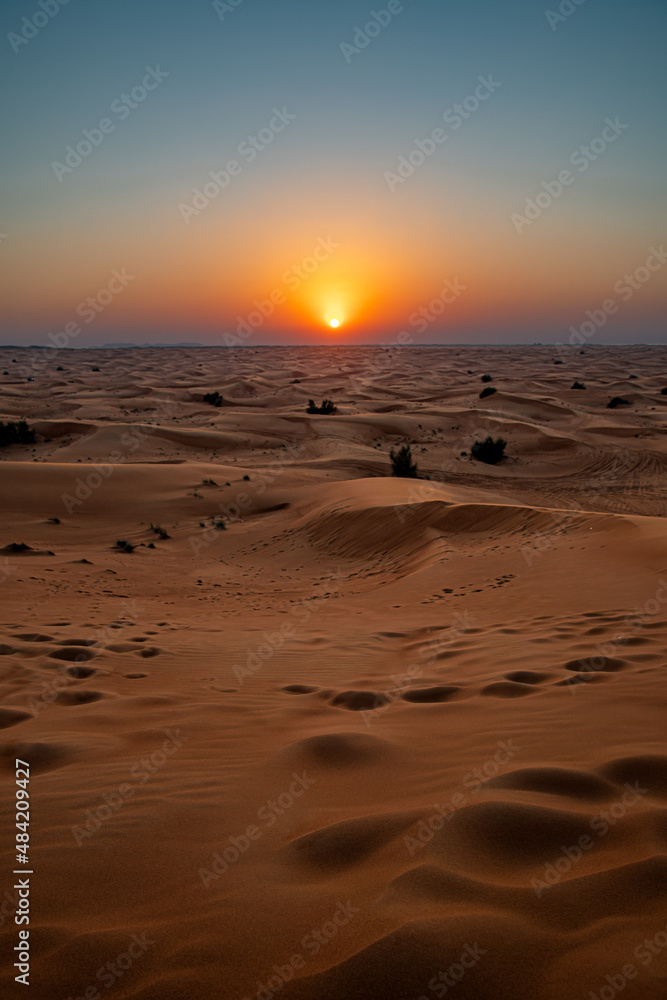 Sunset in the desert dunes of Dubai