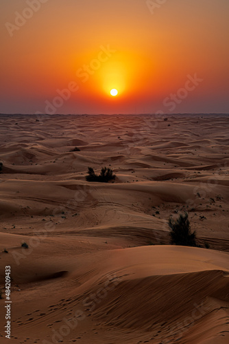 Sunset in the desert dunes of Dubai