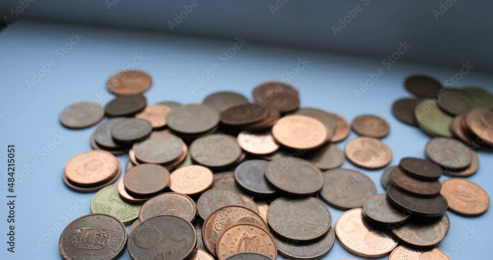 coins of different denominations made of metal on the table coins of different denominations made of metal on the table