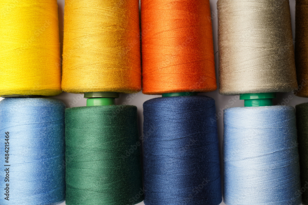 Colorful thread spool background, close-up Colorful thread spool background, close-up