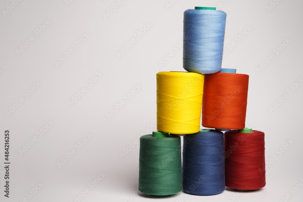 Colorful thread spool background, close-up Colorful thread spool background, close-up