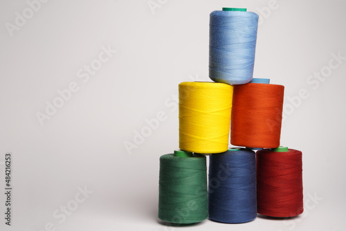 Colorful thread spool background, close-up
