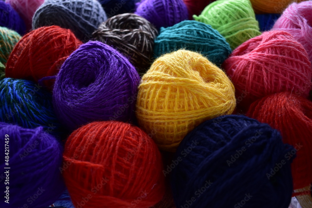 view of multicolored skeins of woolen threads view of multicolored skeins of woolen threads