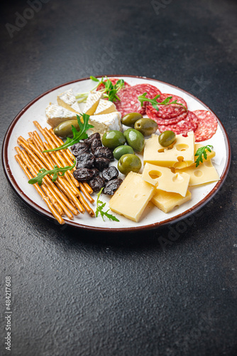 appetizer plate cheese, sausage, olives, bread sticks ready to eat fresh portion dietary healthy meal food diet still life snack on the table copy space food background rustic top view