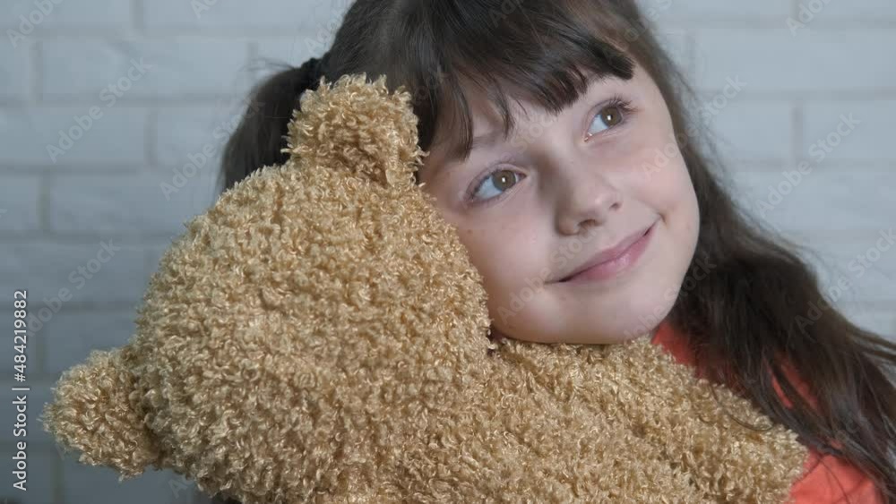 Creative child with teddy bear. An active little girl hugs her teddy bear in the room. Creative child with teddy bear. An active little girl hugs her teddy bear in the room.