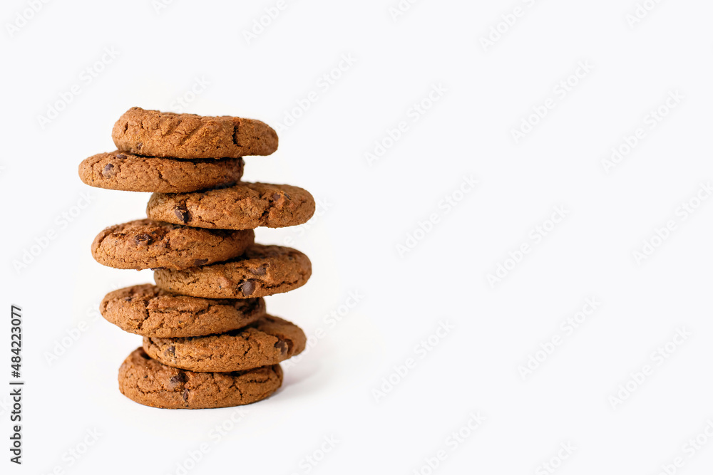 A stack of chocolate chip cookies on a white background. Delicious sweet homemade pastries beautifully stacked close up. Homemade carbohydrate cookies for milk or coffee with free space for text A stack of chocolate chip cookies on a white background. Delicious sweet homemade pastries beautifully stacked close up. Homemade carbohydrate cookies for milk or coffee with free space for text