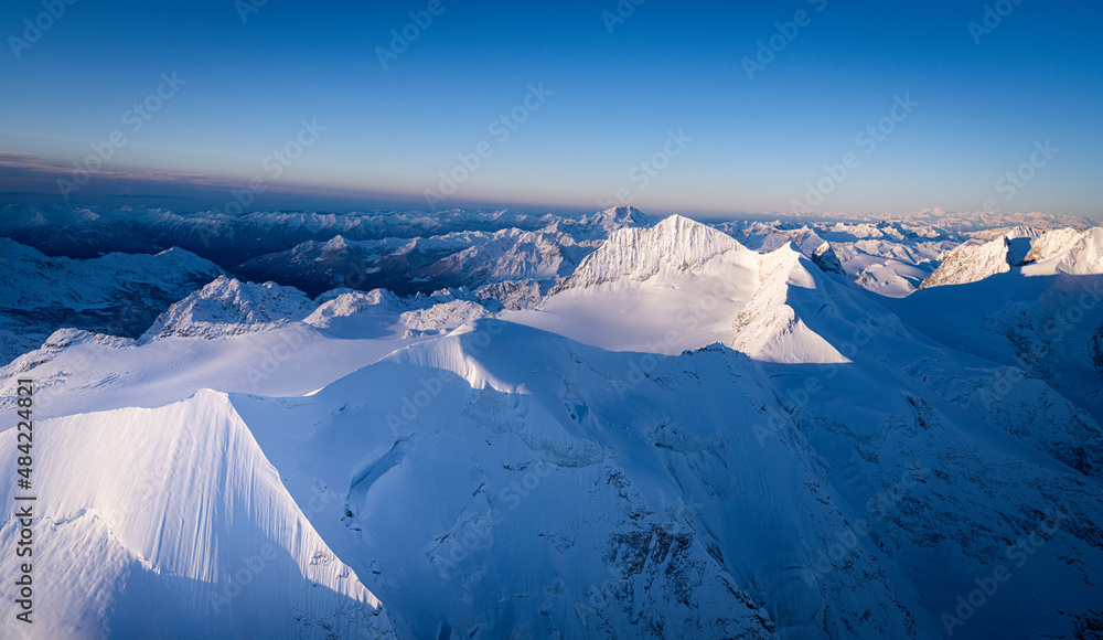 Dramatic sky at dawn on the snowcapped Piz Palu, Bellavista, Piz Zupo and Monte Disgrazia, Engadine, Graubunden Canton, Switzerland Dramatic sky at dawn on the snowcapped Piz Palu, Bellavista, Piz Zupo and Monte Disgrazia, Engadine, Graubunden Canton, Switzerland