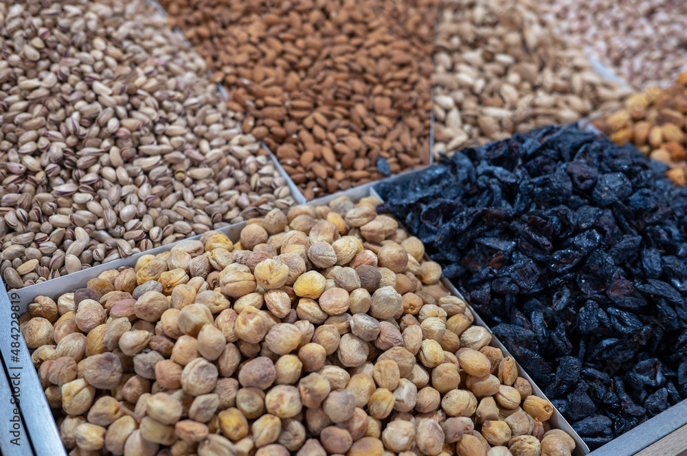 Obraz premium Dried fruits and nuts on local food market