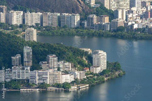 Beautiful view to city buildings and lagoon from green mountain photo