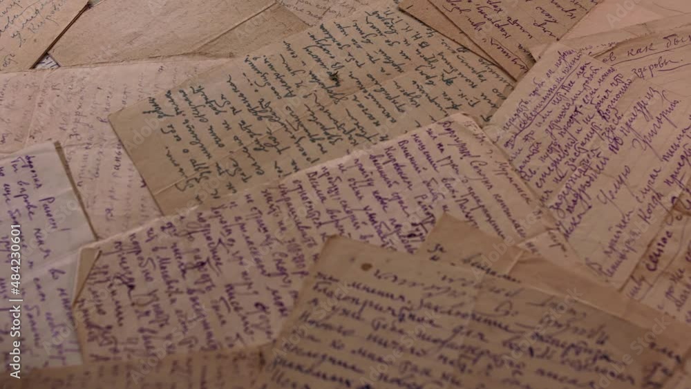 Table covered with many old letters. Left to right panoramic view with selective focus Table covered with many old letters. Left to right panoramic view with selective focus