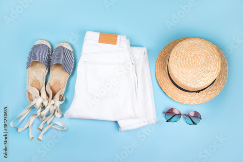 Summer fashion flatlay with white jeans