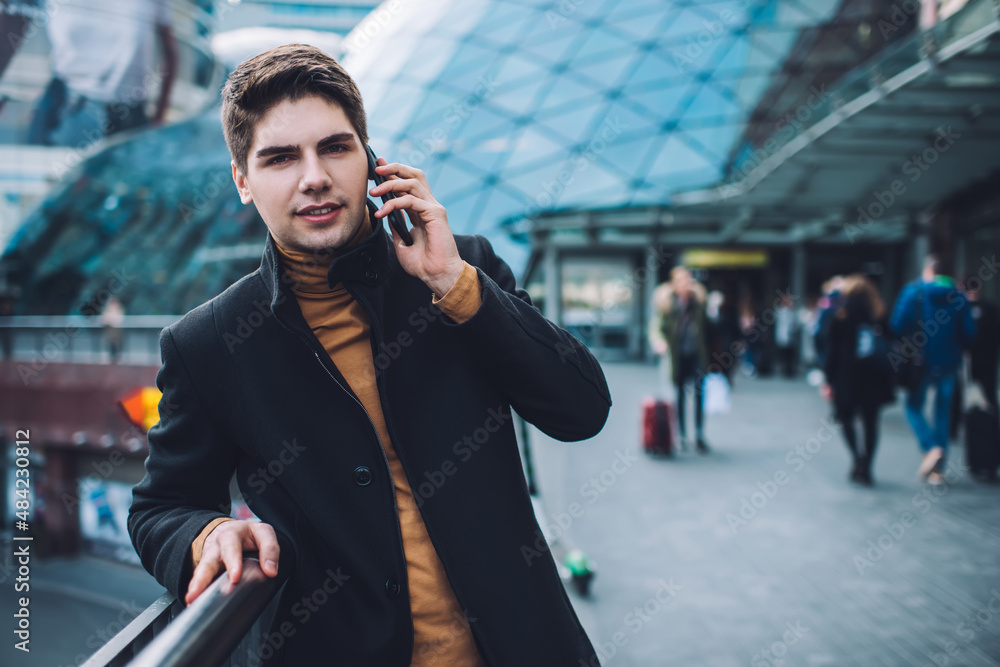 Stylish businessman talking on smartphone outside Stylish businessman talking on smartphone outside