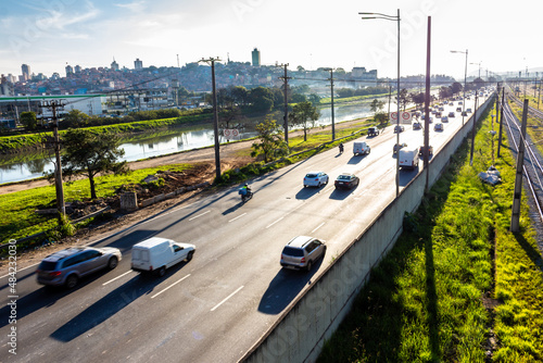 Sao Paulo, Brazil, June 17, 2016. vehicles traffic and train CPTM, in the Marginal Pinheiros and the United Nations Avenue, at the height of the Jaguare district, west side of Sao Paulo photo