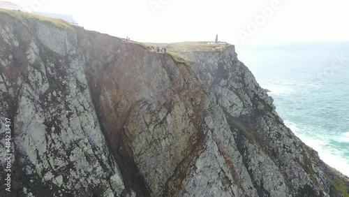 aerial view of the westernmost point of Europe Cape Roca and the red lighthouse on the rocks in Portugal