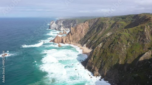 aerial view of the westernmost point of Europe Cape Roca and the red lighthouse on the rocks in Portugal