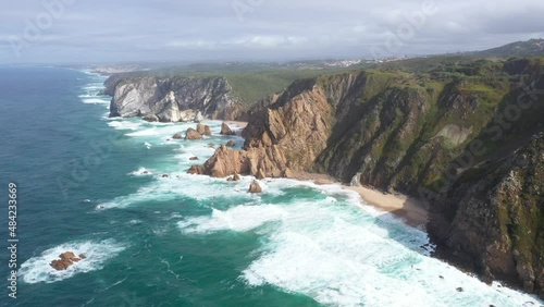 aerial view of the westernmost point of Europe Cape Roca and the red lighthouse on the rocks in Portugal