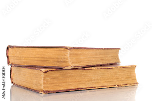 Two old books, macro shot, isolated on a white background.