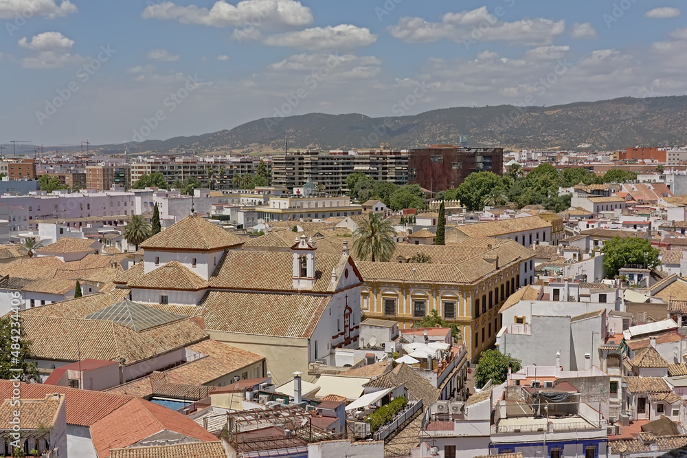  High angle view on the tradititonal houses of Cordoba, Andalusia, Spain, with mountains in the background 