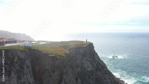 aerial view of the westernmost point of Europe Cape Roca and the red lighthouse on the rocks in Portugal