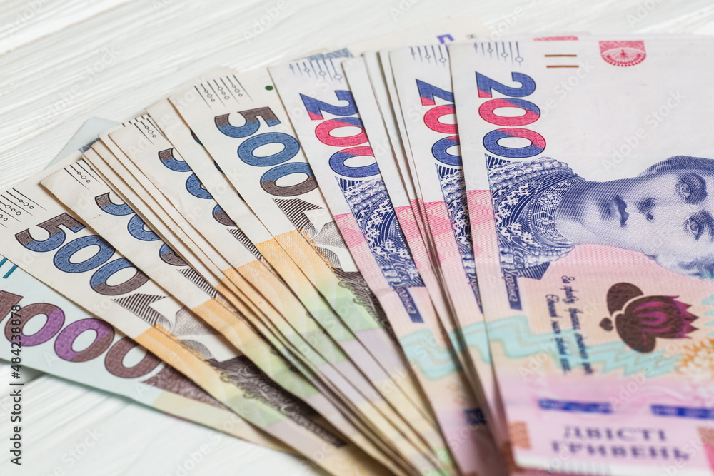 Stack of ukrainian hryvnia banknotes on table Stack of ukrainian hryvnia banknotes on table