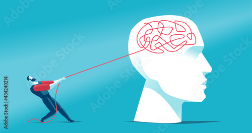Uomo che cerca a districare il groviglio di pensieri nel cervello umano