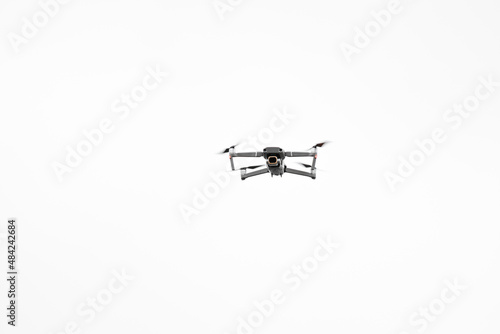 Quadcopter camera drone in flight isolated
