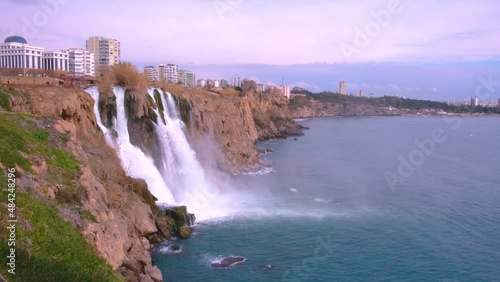 Antalya, Turkey, February 01 2022: Karpuzkaldiran, Duden waterfall falling into the Mediterranean sea from Cliff Falezler. photo