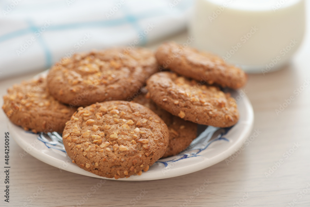 Oatmeal cookies with peanut crumbs and glass of milk Oatmeal cookies with peanut crumbs and glass of milk