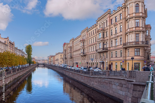view of the canal with granite banks and beautiful old buildings on the embankment in the historical part of the Russian city of St. Petersburg © westermak15