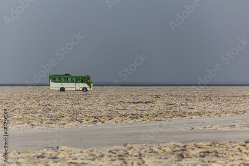 Small bus at the salt flats of Danakil depression, Ethiopia photo