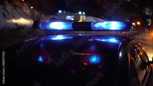 police car flashing lights night winter