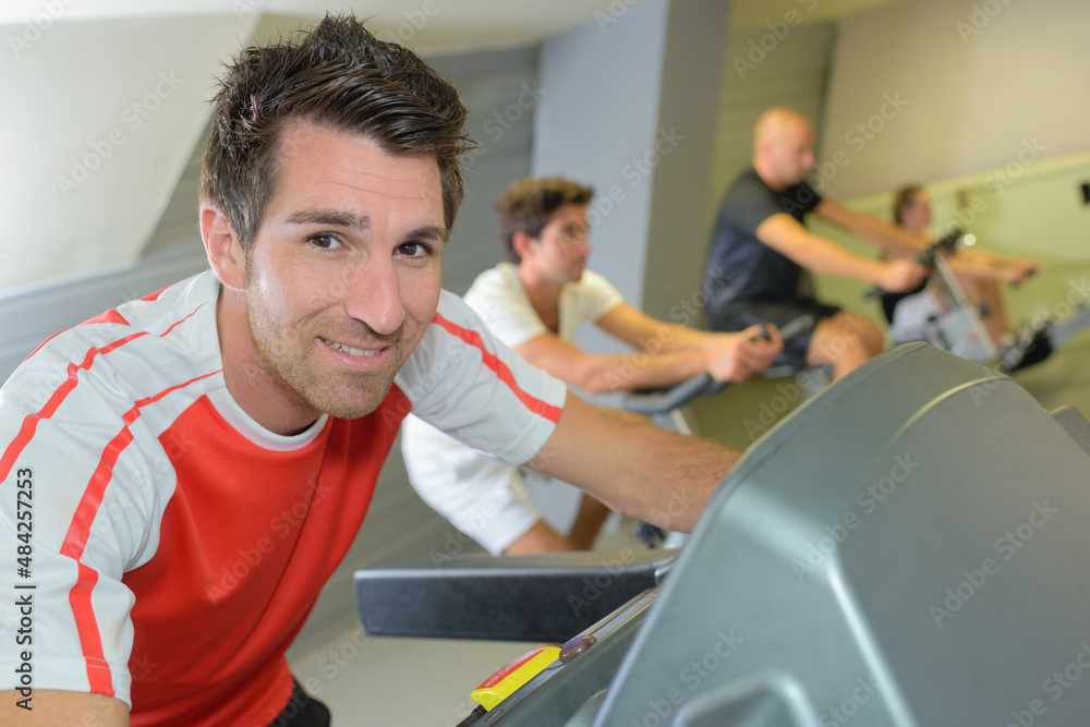 Obraz premium portrait of man on fitness machine