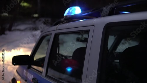 police car flashing lights night winter