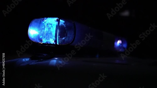 police car flashing lights night winter