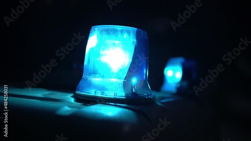 police car flashing lights night winter
