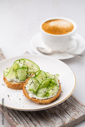 Keto Toasts with ricotta, egg, cucumber and black sesame.